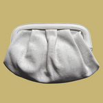 Load image into Gallery viewer, A white textured leather clutch bag with a pleated, gathered design and a smooth top frame, shown against a solid black background.