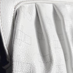 Load image into Gallery viewer, Close-up of a white textured leather bag with a subtle geometric line pattern, showing the pebbled leather texture and draped folds.